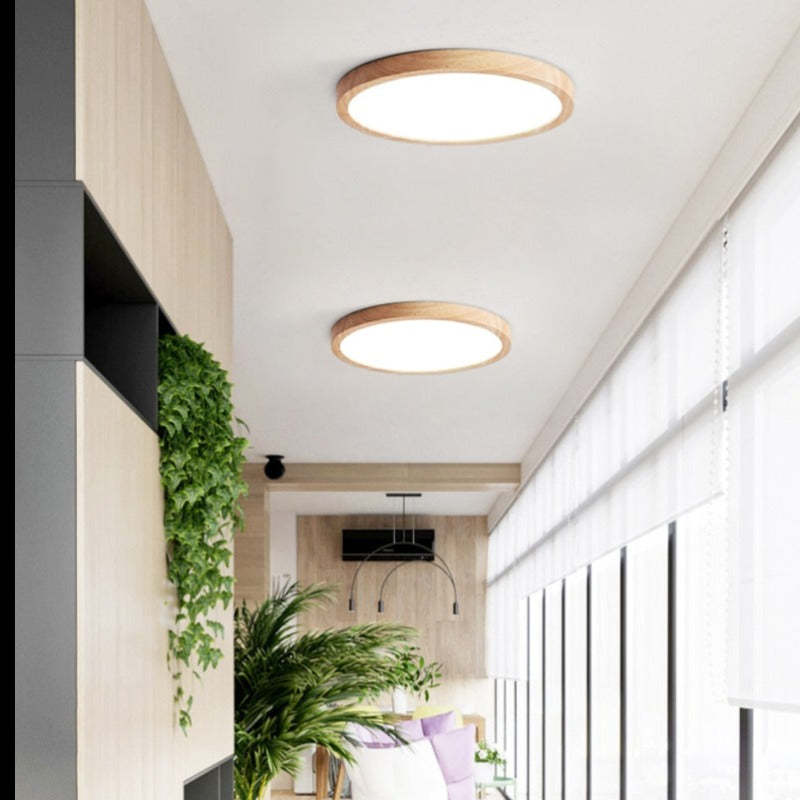 Two Ozawa wood-rim ceiling lights in a long bright room