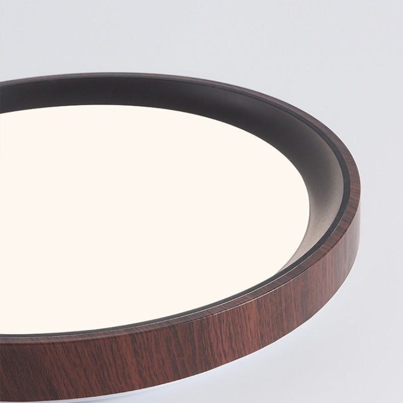 Close view of Quinn dark wood-grain outer rim and black inner trim