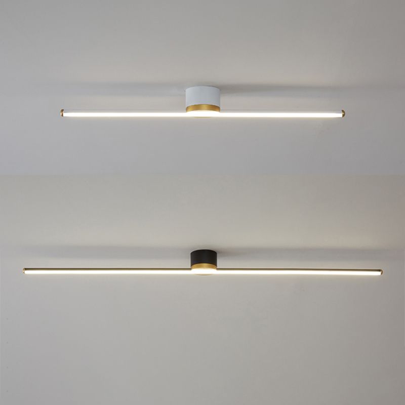 White and black Edge ceiling bars pictured parallel, with bright lower faces, gold-tone ends and central mount rims.