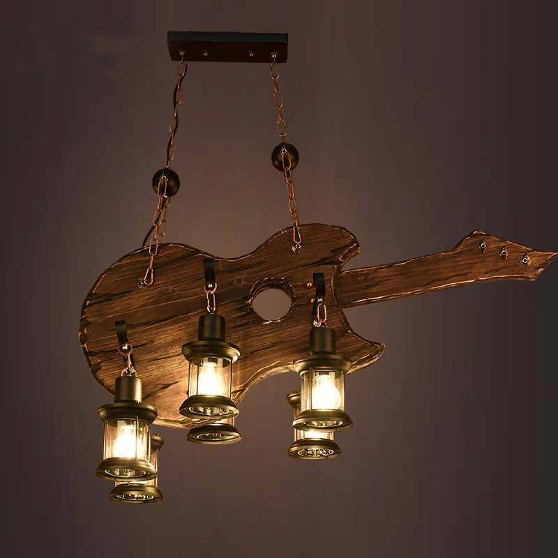 Austin guitar pendant with lit lanterns against a dark wall