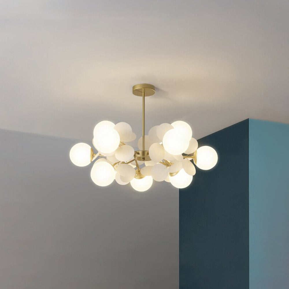 Jevon White 29.5-inch 12-light option with white globes and pale petals beneath a gold-tone stem and round canopy.