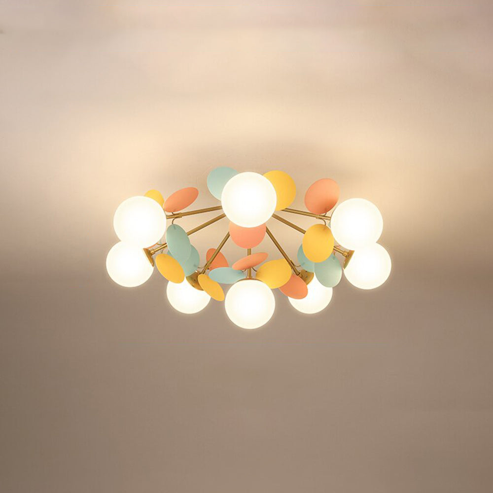 Jevon colourful petal cluster seen from below, with white globes on spreading gold-tone branches.