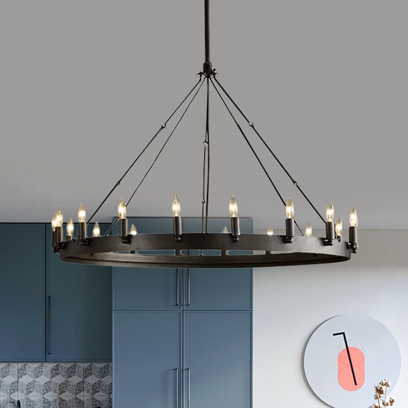 Alessio black wheel pendant in a dining area, with an inset highlighting the suspension hardware.