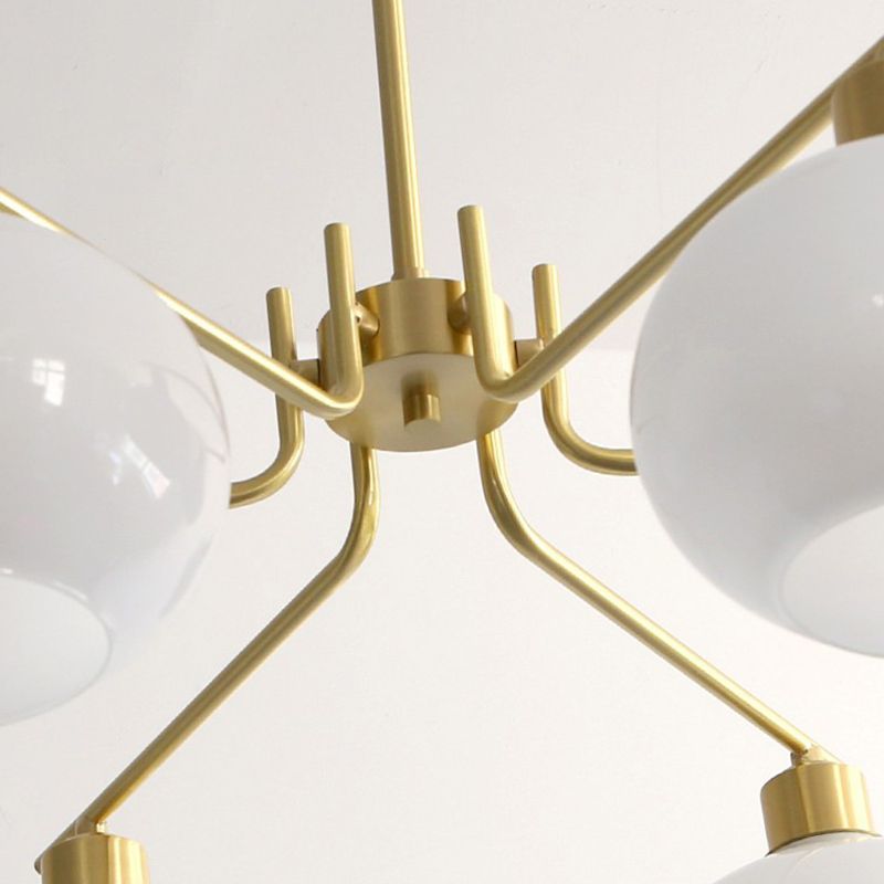 Valentina brass-finish centre hub, ceiling rod and curved arm details