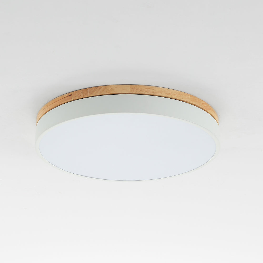 Morandi near the ceiling with segmented wood-tone upper trim, a pale rim and an unlit-looking circular face.