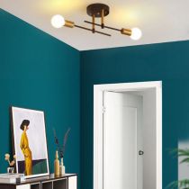 Valentina ceiling light near teal walls, a white doorframe and a console with leaning artwork of a figure in yellow.