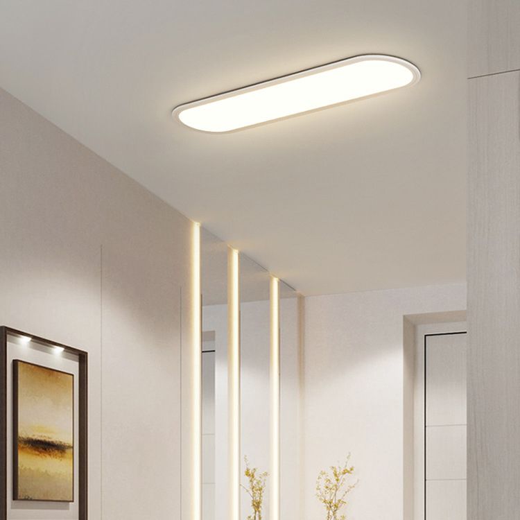 White Edge ceiling light above gold-toned wall artwork, three separate vertical light strips and yellow floral branches, beside a white door.
