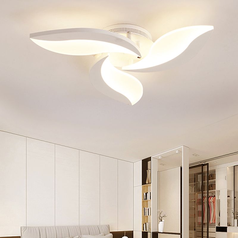 Illuminated Hana three-petal light above a bright bedroom