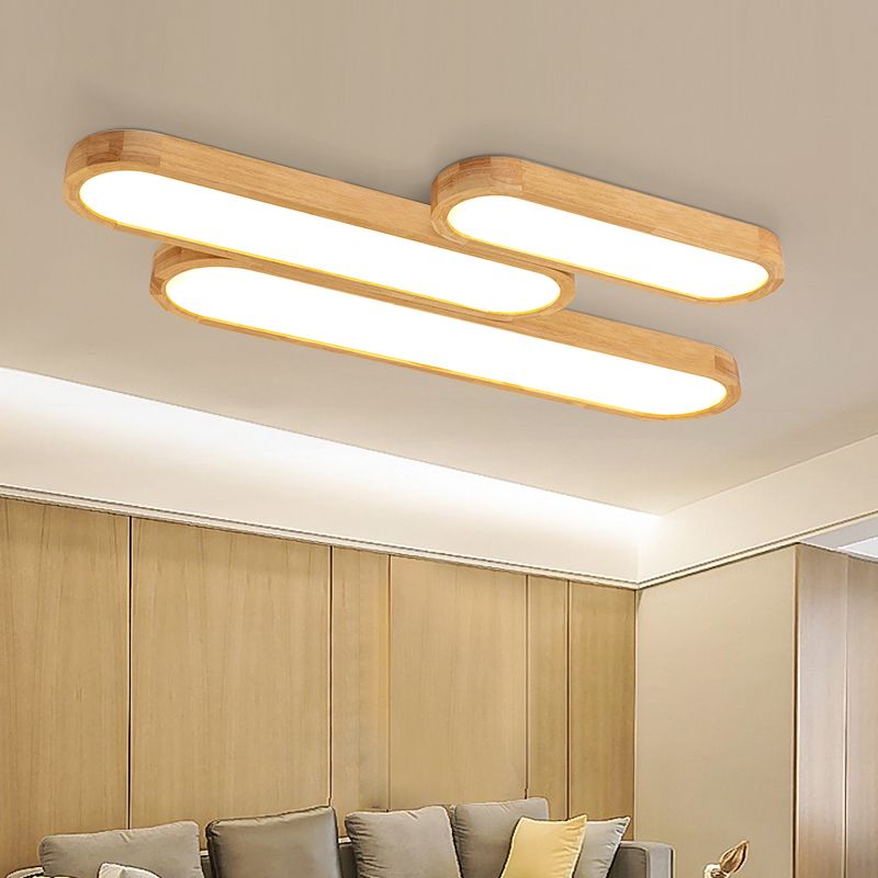 Three Ozawa elongated lights pictured together above a sofa
