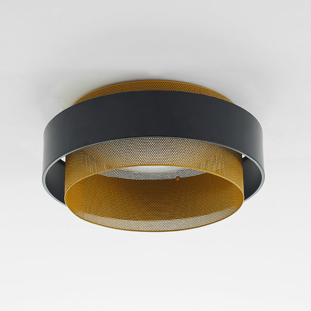 Unlit black-and-gold Quinn ring light from below, with perforations, dark connecting supports and pale centre.