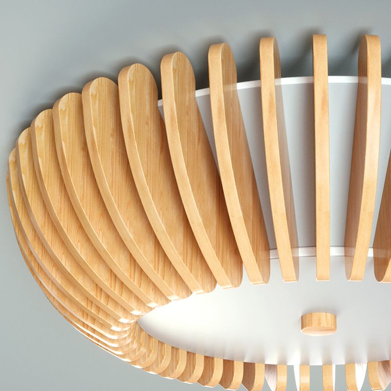 Side detail of unlit Ozawa with curved wooden slats, pale inner shade and lower disc close to a pale ceiling.