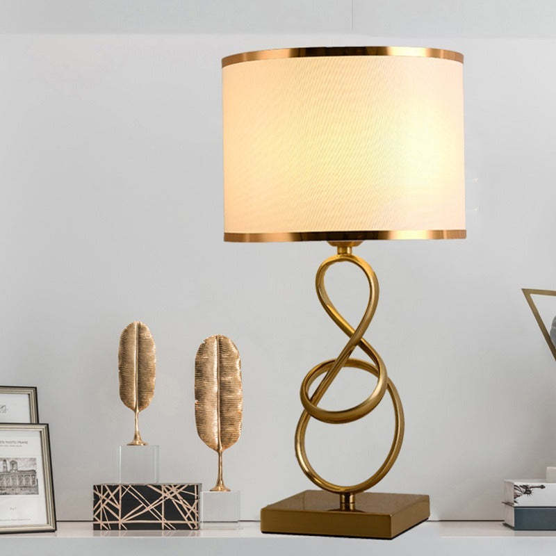 White-shade Sano table lamp on a cabinet