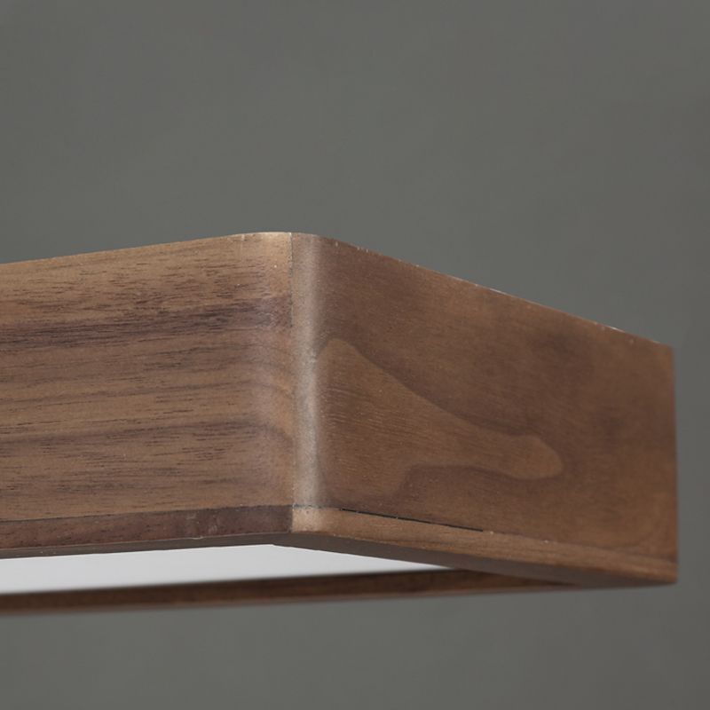 Close view of Ozawa wood-grain corner and pale diffuser edge
