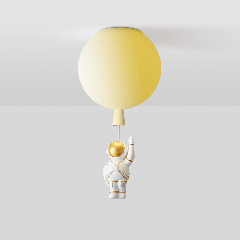 Yellow balloon globe above a one-arm-up white astronaut with gold-tone visor and silver-tone leg details, joined by a pale link.