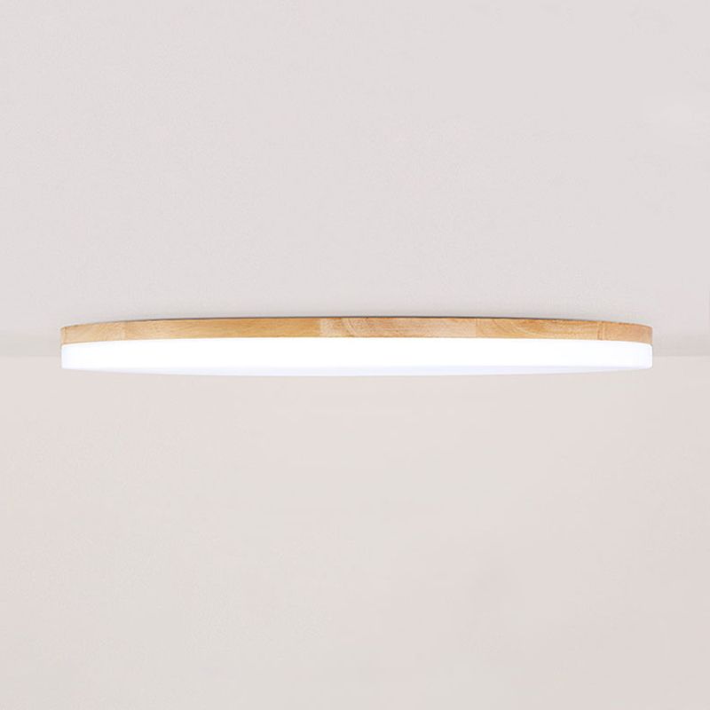 Side view of the slim Ozawa ceiling light with a wood rim and white lower diffuser.