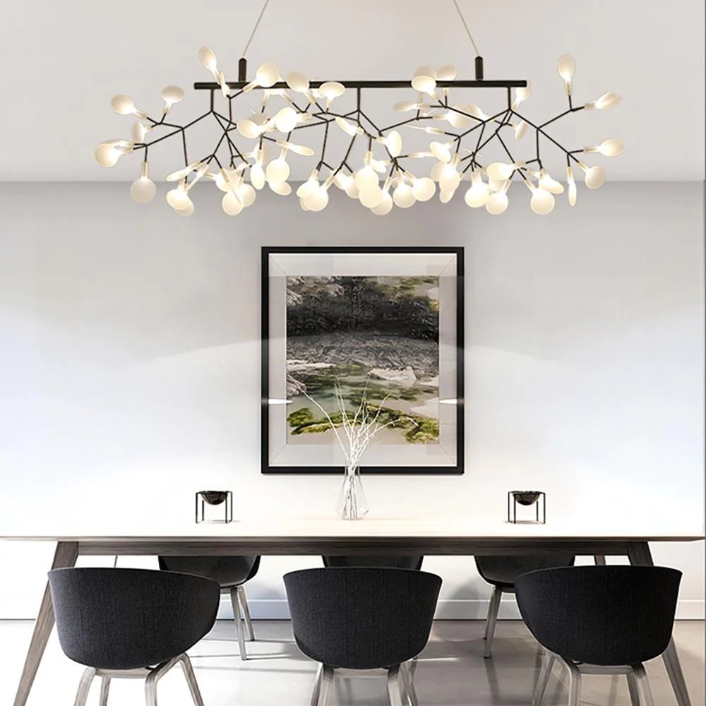 Linear black branched chandelier above a table
