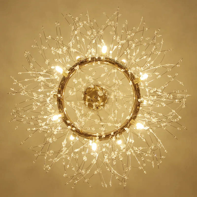 Upward view of Lili’s open gold-coloured ring, visible lights and radiating crystal branches around the ceiling canopy.