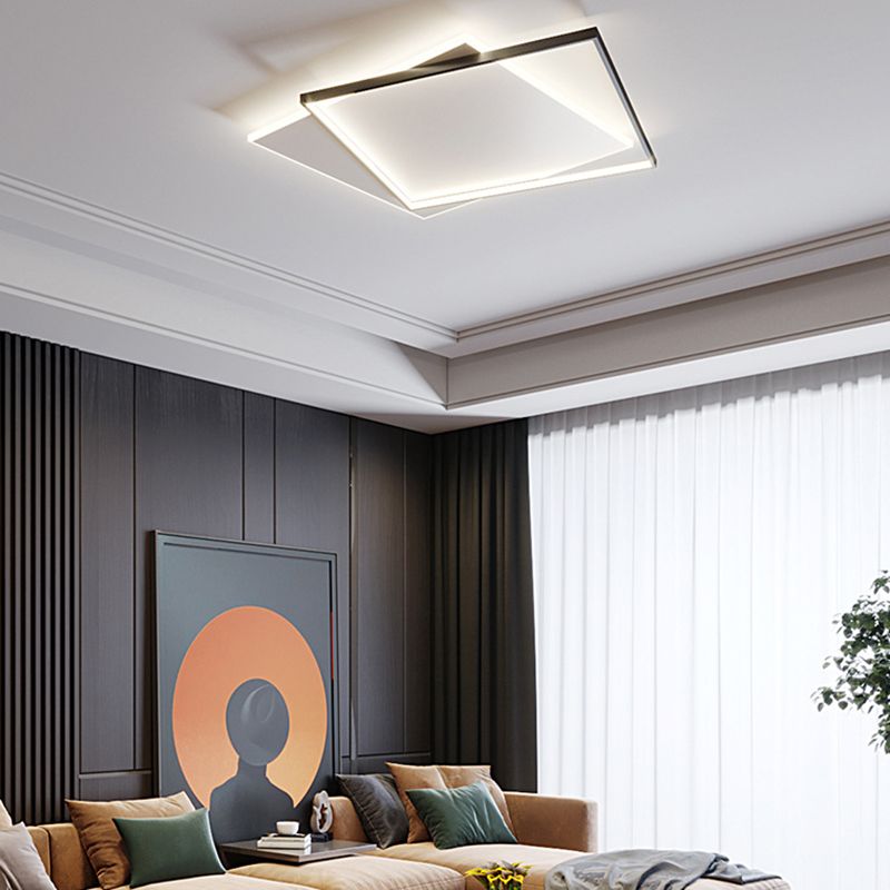Quinn offset square ceiling light above a tan sofa, green cushions and an orange-circle portrait against dark wall panels.