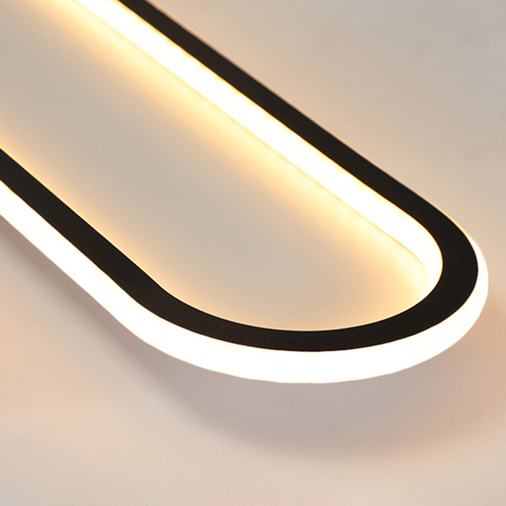 Black Quinn rounded-end detail with black perimeter line, bright white outer band and warm-looking inner illuminated edge.