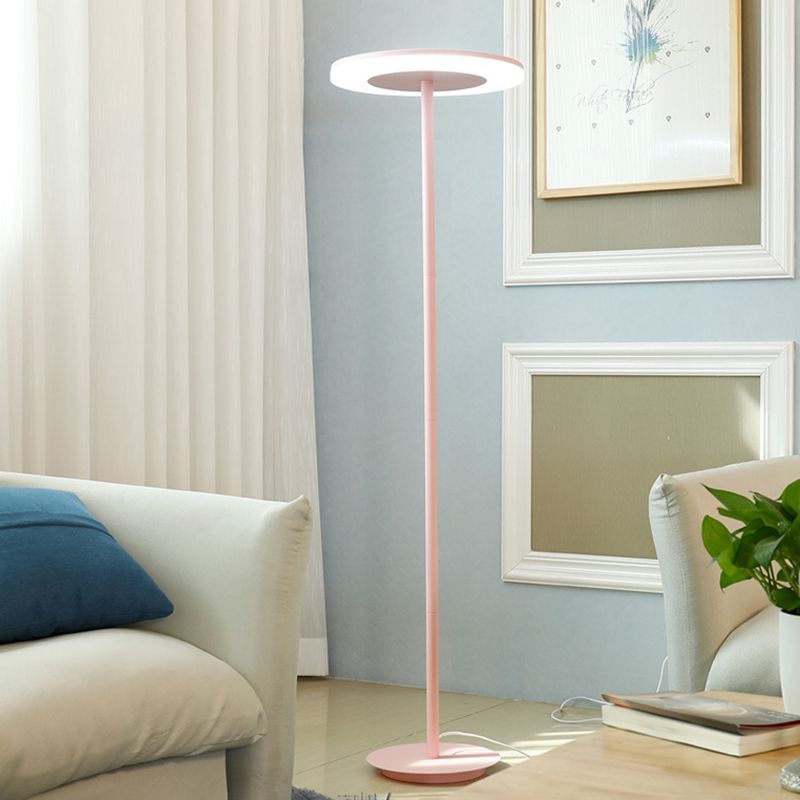 Morandi pink disc floor lamp beside a sofa