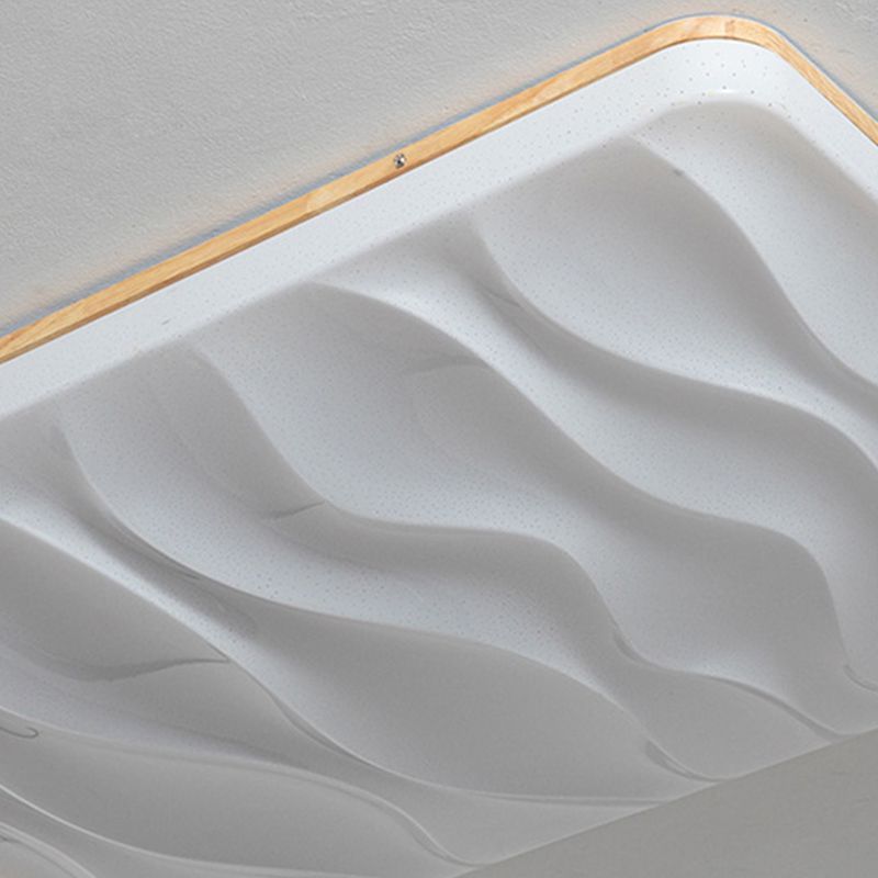 Close-up of an unlit Ozawa white face with raised wave-like folds, tiny dot markings and a wood-tone rim with a visible screw.
