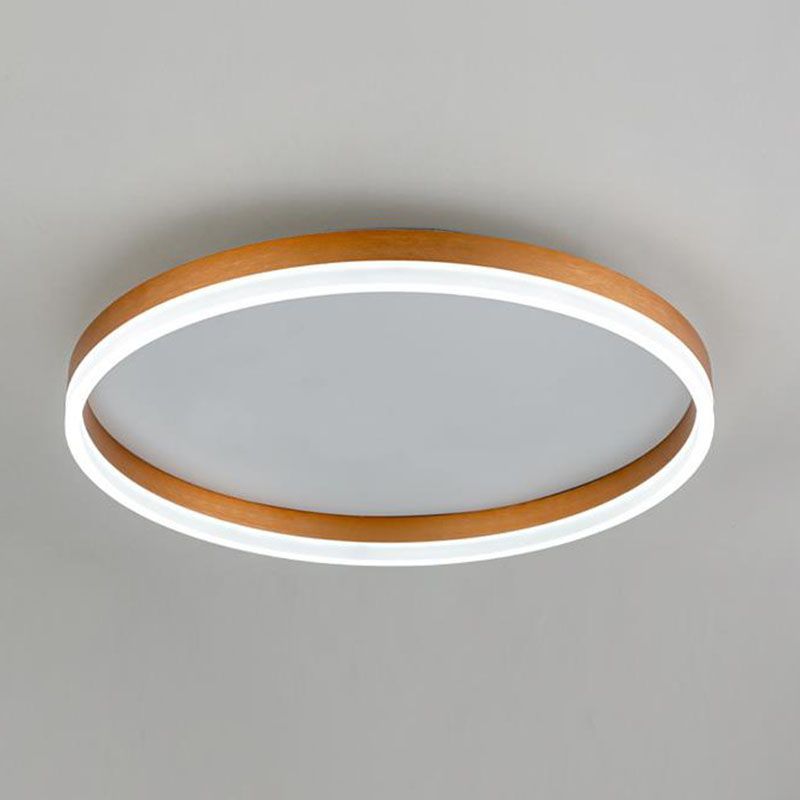 Gold-tone Arisha ring on a pale ceiling, showing streaked outer and inner surfaces and a pale lower light strip.