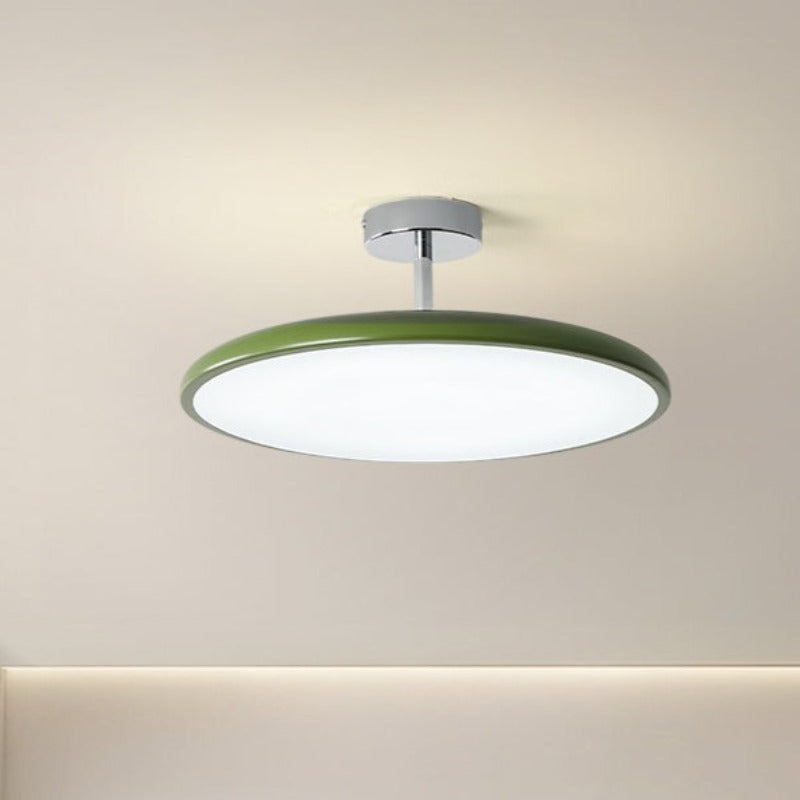 Green Valentina ceiling light with an illuminated white disc beneath a short stem.