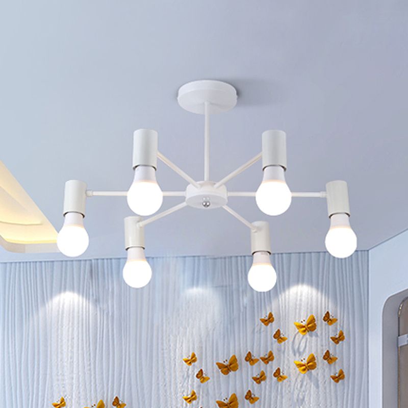 White six-light ceiling fixture above curtains and gold butterfly wall decorations