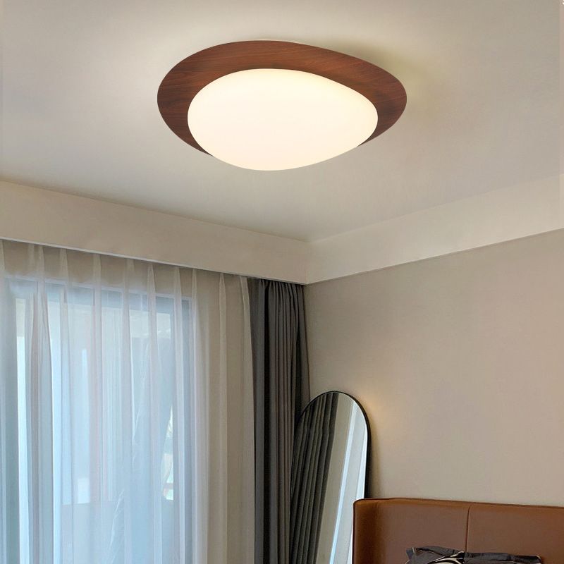 Walnut-colour Quinn ceiling light in a bedroom near curtains