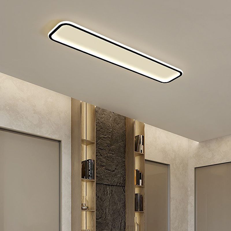 Edge ceiling light above a bathroom with a mirror and wall fittings