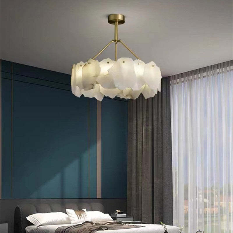 Marilyn pale marble ring pendant hanging in a dark teal bedroom
