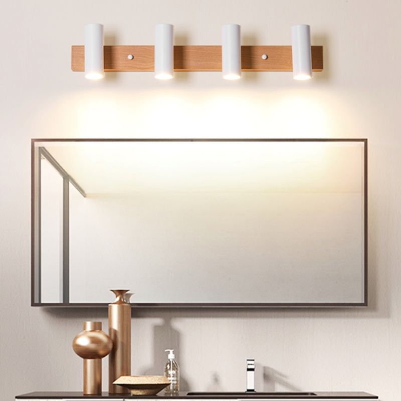Four white Ozawa spots above a framed mirror with basin and metal vases in the room setting