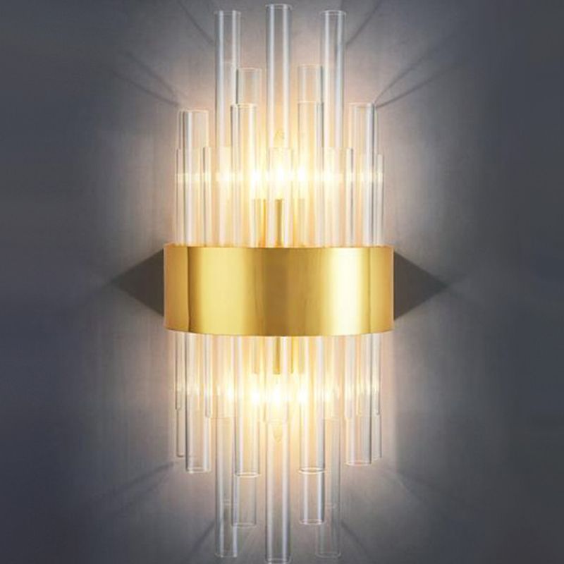 Kristy K clear cylindrical rods at different heights around a broad gold-tone central band