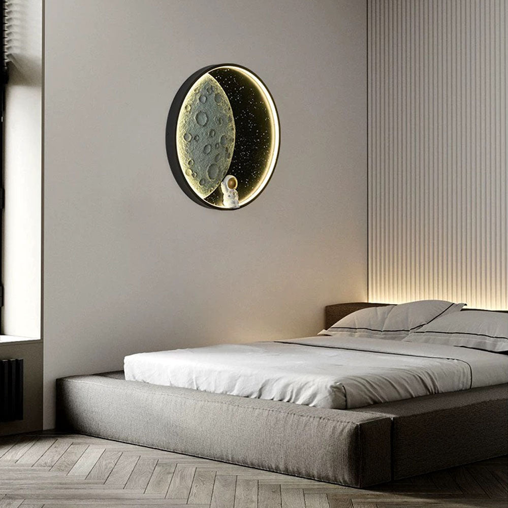 Moon and astronaut lamp on a bedroom wall