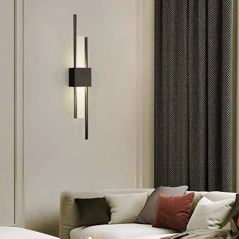 Black Alana wall light with offset vertical bars in a living room