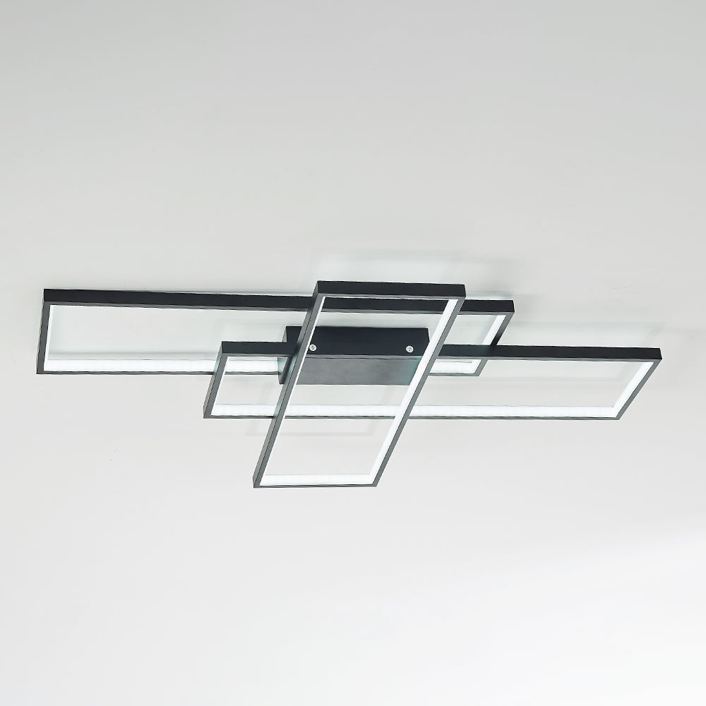Underside view of black overlapping open rectangular frames and a central housing with two visible side screws