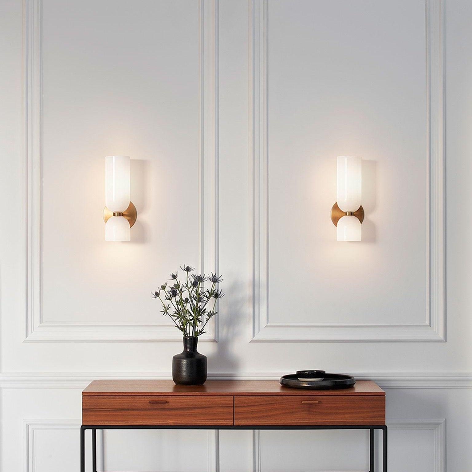 Two White Hailie fixtures above an indoor console