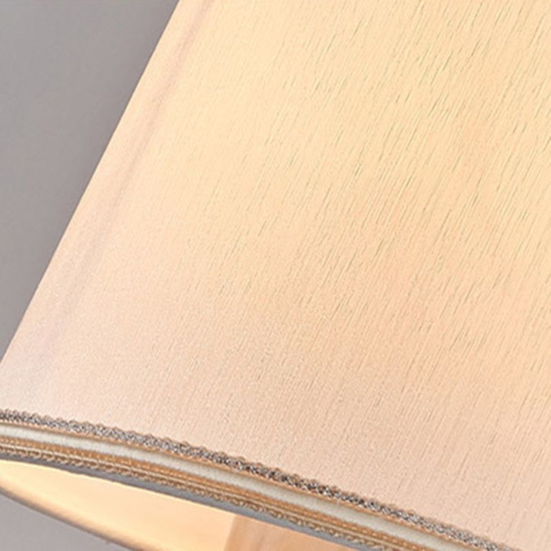 Close fabric texture and decorative lower-edge trim on Eryn pale tapered shade