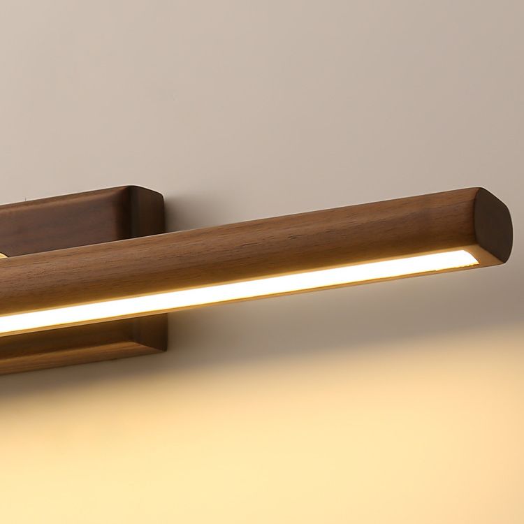 Close-up of Ozawa rounded wood bar end, grain and lit underside strip