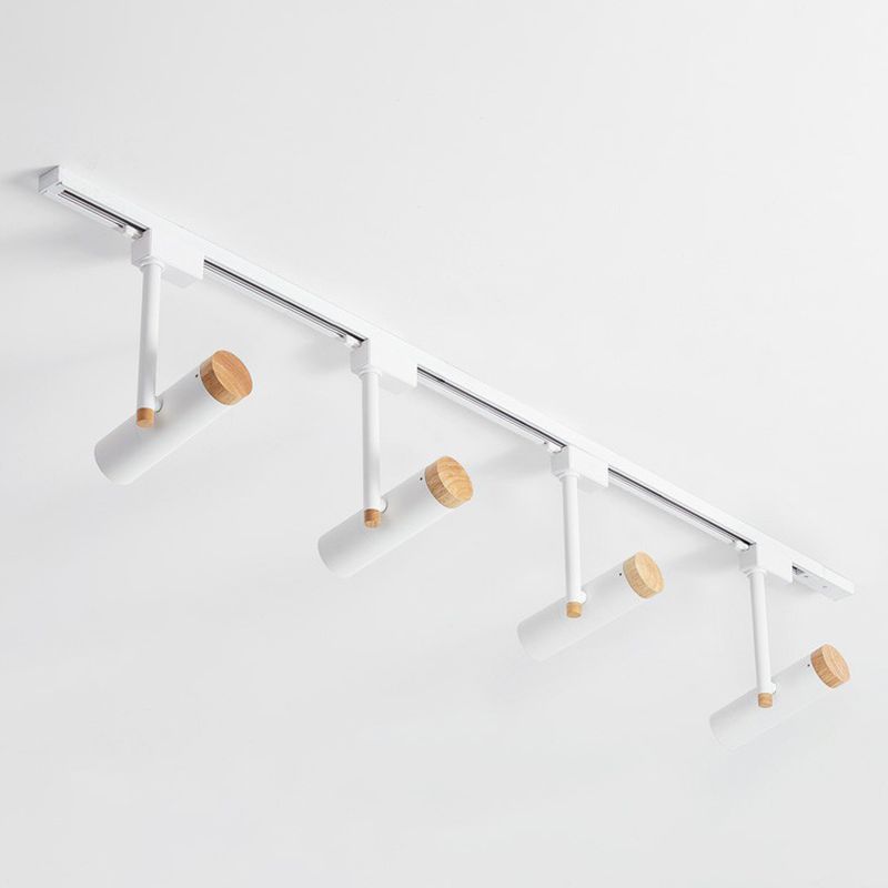 White four-head ceiling spotlight rail with wood caps and angled cylinders
