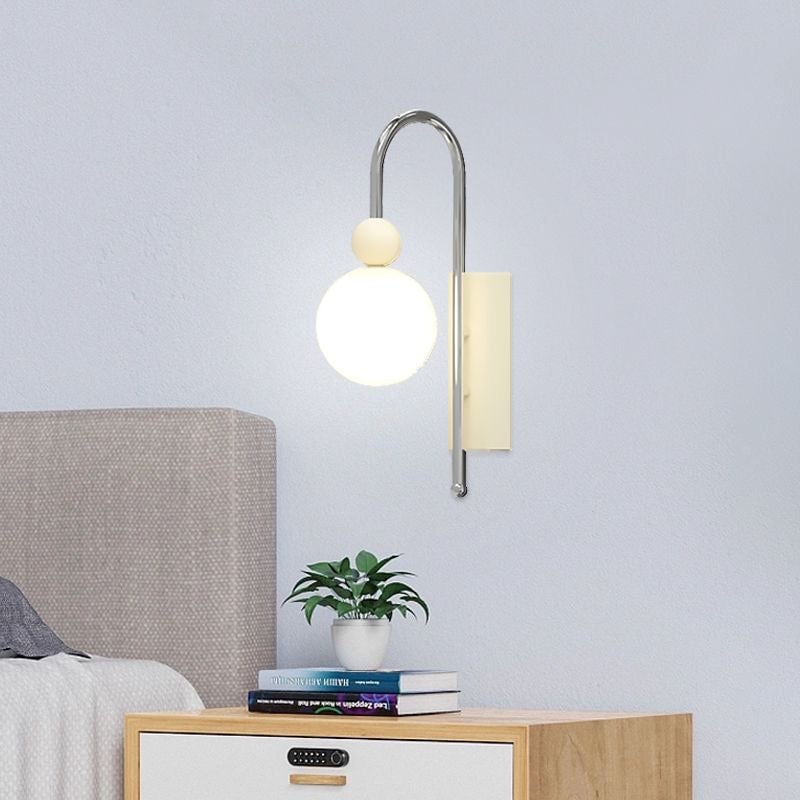 Pale Coffee Model D beside a bed and cabinet