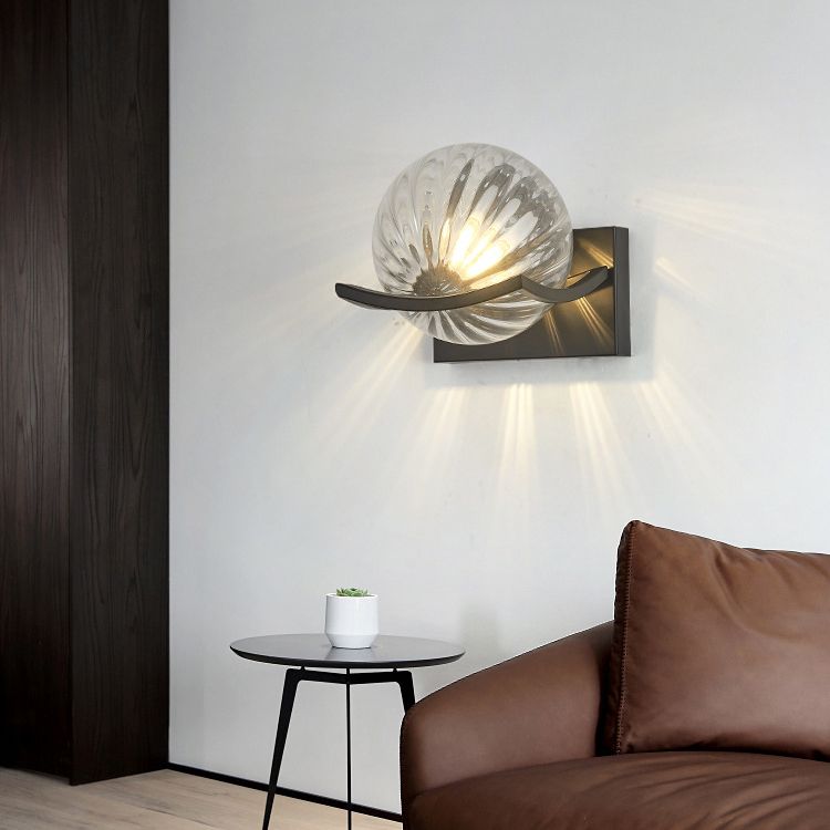 Valentina clear spiral-ribbed globe wall lamp in a room