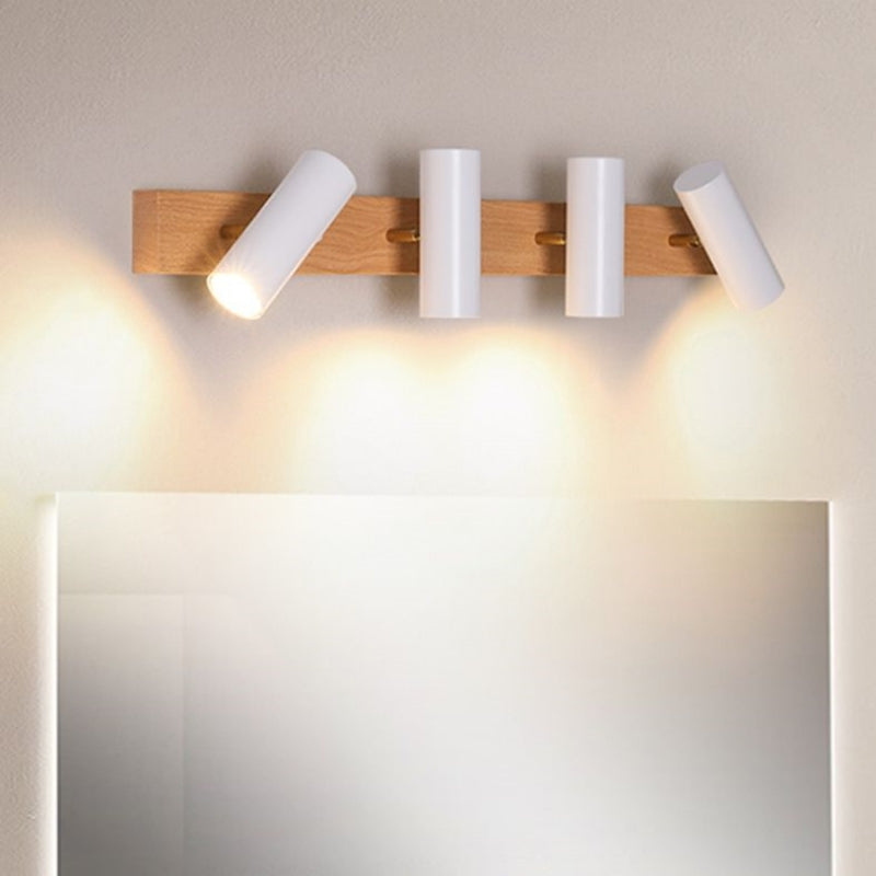 Four white Ozawa spots on a wooden bar, outer heads tilted and central heads facing down