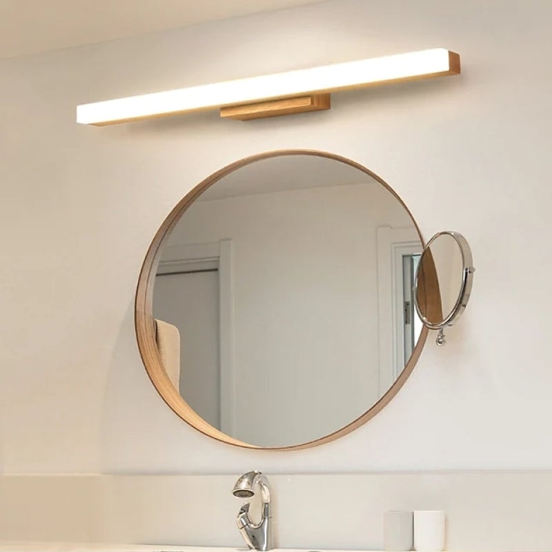 Light wood Leigh bar above a round mirror and basin