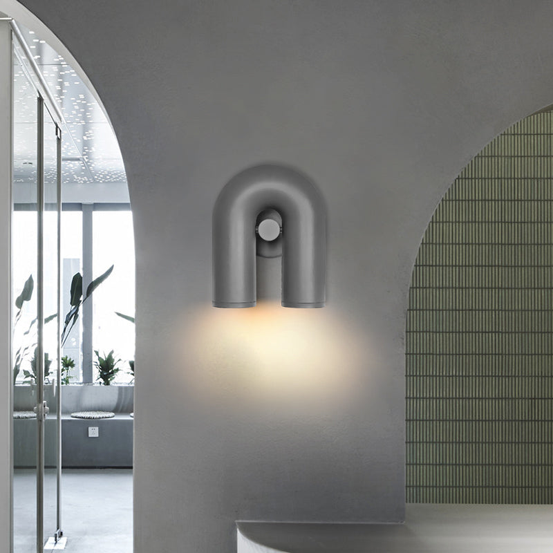 Gray option photo, U-shaped light on gray arched wall beside glazed opening, plants, green-tiled curved surface and counter