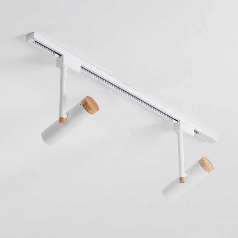White two-head ceiling spotlight rail with angled cylinders and wood caps