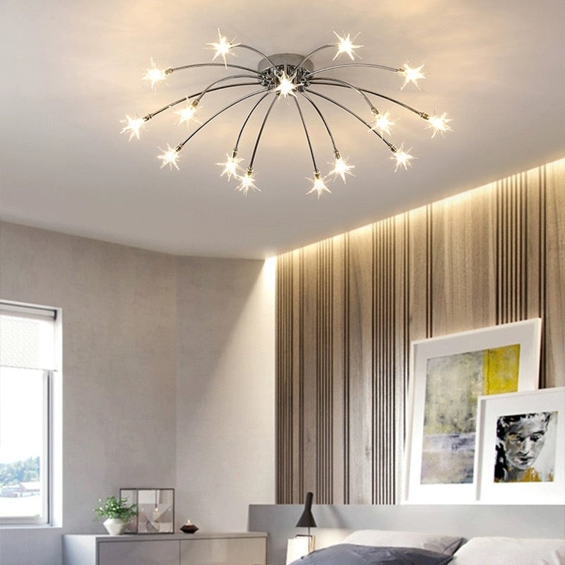 Chrome-tone glass star ceiling light above bed, vertical timber wall and framed prints, shared reference for 12 and 15 lights