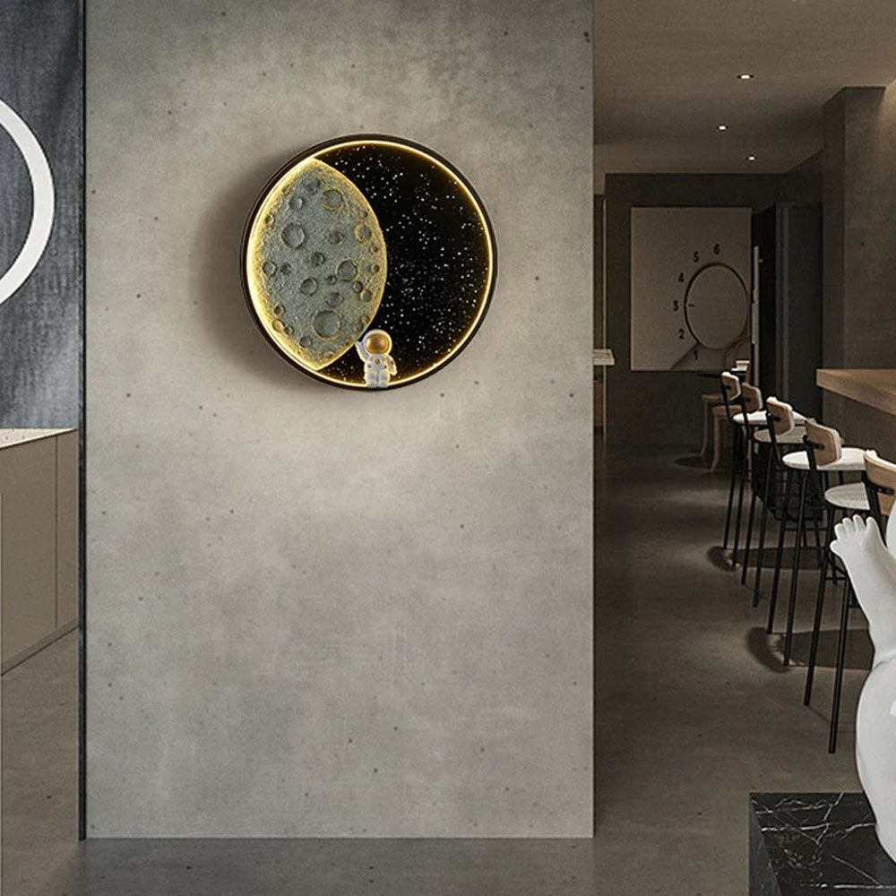 Warm lunar disc light on a concrete-look wall