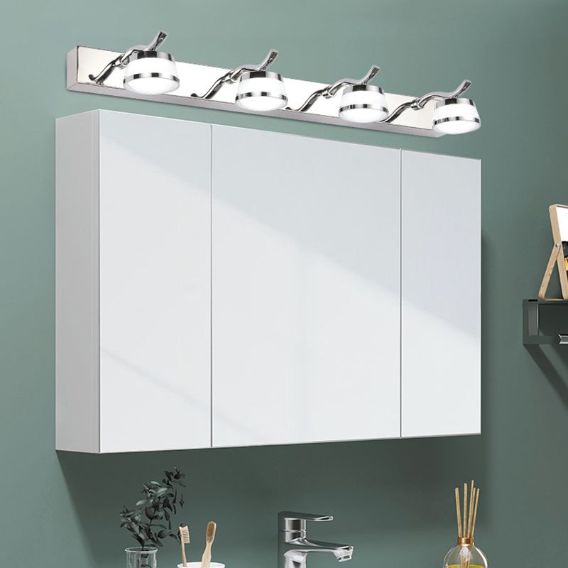 Four-light Leigh fixture mounted above a white bathroom mirror cabinet.