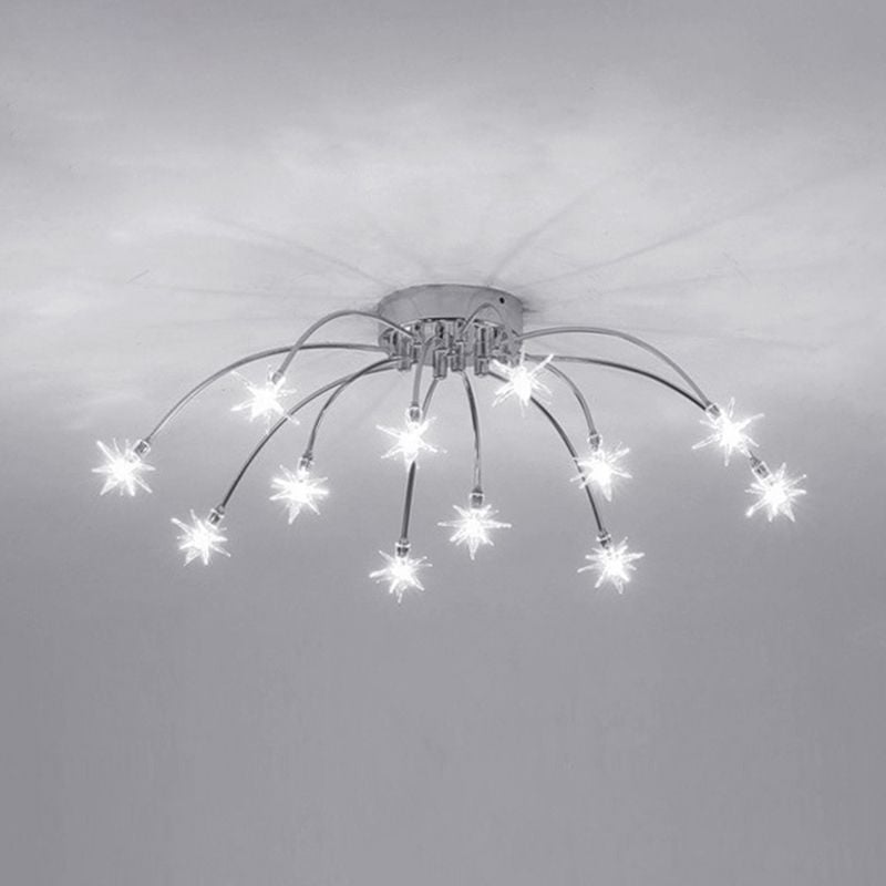 Monochrome small starburst ceiling fixture seen from below, with lit pointed stars and radiating shadows